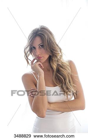 Portrait of a pensive woman with white background looking at camera View Large Photo Image Stock Photo - Portrait of a pensive woman with white background looking at camera. Fotosearch