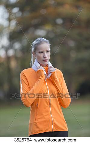 Portrait of a pretty blonde woman doing sport in park View Large Photo Image Picture - Portrait of a pretty blonde woman doing sport in park. Fotosearch