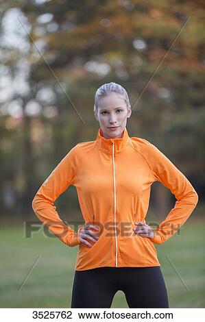 Portrait of a pretty blonde woman doing sport in park looking at camera View Large Photo Image Stock Image - Portrait of a pretty blonde woman doing sport in park looking at camera. Fotosearch