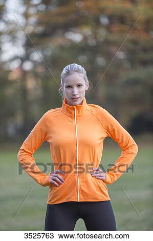 Portrait of a pretty blonde woman doing sport in park looking at camera View Large Photo Image Stock Image - Portrait of a pretty blonde woman doing sport in park looking at camera. Fotosearch