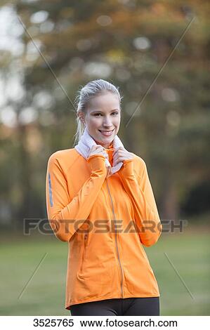Portrait of a pretty blonde woman doing sport in park smiling at camera View Large Photo Image Stock Photography - Portrait of a pretty blonde woman doing sport in park smiling at camera. Fotosearch