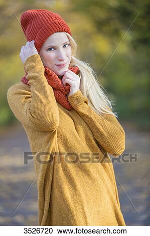 Portrait of a pretty blonde woman in park in autumn smiling at camera View Large Photo Image Stock Image - Portrait of a pretty blonde woman in park in autumn smiling at camera. Fotosearch