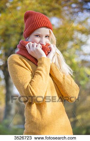 Portrait of a pretty blonde woman in park in autumn smiling at camera View Large Photo Image Stock Image - Portrait of a pretty blonde woman in park in autumn smiling at camera. Fotosearch