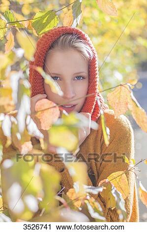 Portrait of a pretty blonde woman in park in autumn with leaves View Large Photo Image Stock Image - Portrait of a pretty blonde woman in park in autumn with leaves. Fotosearch