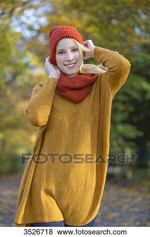Portrait of a pretty blonde woman in park in autumn View Large Photo Image Stock Photo - Portrait of a pretty blonde woman in park in autumn. Fotosearch
