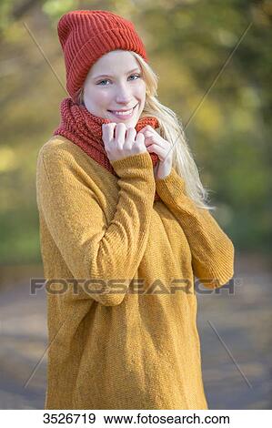 Portrait of a pretty blonde woman in park in autumn View Large Photo Image Stock Photo - Portrait of a pretty blonde woman in park in autumn. Fotosearch