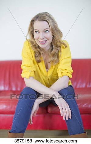 Portrait of a pretty blonde woman on the couch View Large Photo Image Stock Photo - Portrait of a pretty blonde woman on the couch. Fotosearch