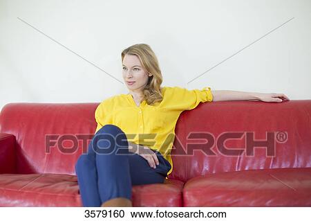 Portrait of a pretty pensive woman on the couch View Large Photo Image Stock Image - Portrait of a pretty pensive woman on the couch. Fotosearch