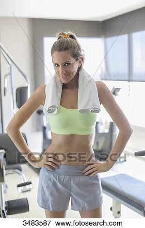 Portrait of a pretty woman in fitness center View Large Photo Image Stock Photo - Portrait of a pretty woman in fitness center. Fotosearch