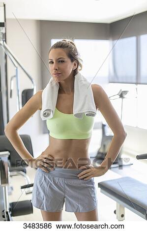 Portrait of a pretty woman in fitness center View Large Photo Image Stock Photograph - Portrait of a pretty woman in fitness center. Fotosearch