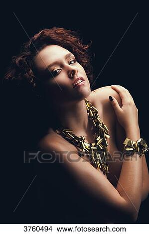 Portrait of a young girl arms crossed, looking toward the lens View Large Photo Image Picture - Portrait of a young girl arms crossed, looking toward the lens. Fotosearch
