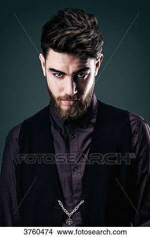 Portrait of a young hipster in shirt and jacket look towards the lens View Large Photo Image Picture - Portrait of a young hipster in shirt and jacket look towards the lens. Fotosearch
