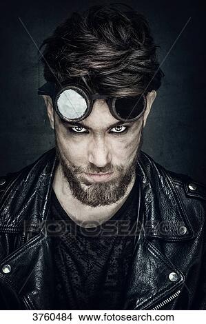 Picture - Portrait of a young hipster leather jacket, looking toward the lens. Fotosearch