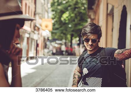 Portrait of a young man waiting on a street, urban environment View Large Photo Image Stock Photography - Portrait of a young man waiting on a street, urban environment. Fotosearch