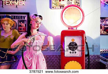 Portrait of a young Pin Up, filling its fuel milkshake View Large Photo Image Stock Image - Portrait of a young Pin Up, filling its fuel milkshake. Fotosearch