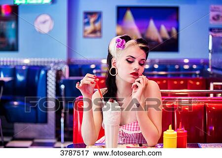 Portrait of a young Pin Up, Front, bored before his milkshake View Large Photo Image Stock Photo - Portrait of a young Pin Up, Front, bored before his milkshake. Fotosearch