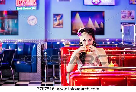 Portrait of a young Pin Up, Front, eating his hamburger View Large Photo Image Stock Photograph - Portrait of a young Pin Up, Front, eating his hamburger. Fotosearch