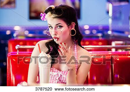 Portrait of a young pin up not knowing his milkshake drink View Large Photo Image Stock Image - Portrait of a young pin up not knowing his milkshake drink. Fotosearch