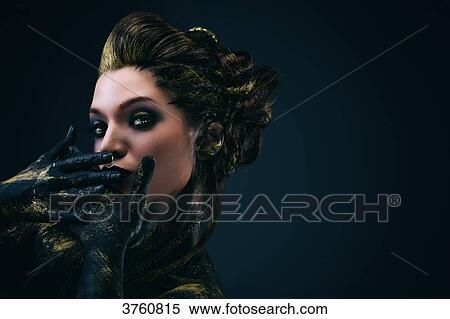 Portrait of a young woman in profile, the body painted black and gold, hands over her mouth, looking toward the lens View Large Photo Image Stock Photography - Portrait of a young woman in profile, the body painted black and gold, hands over her mouth, looking toward the lens. Fotosearch