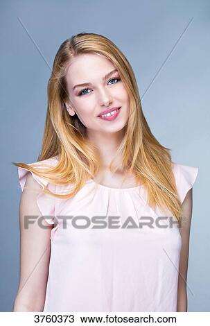 Portrait of a young woman smiling View Large Photo Image Stock Image - Portrait of a young woman smiling. Fotosearch