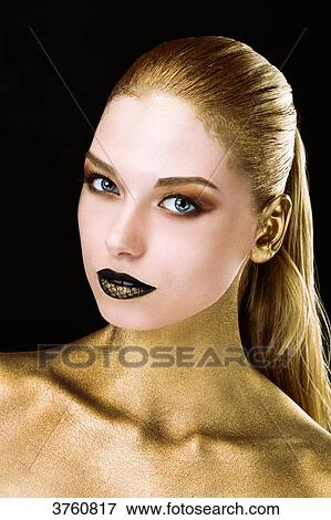 Portrait of a young woman, the body painted in gold, opened the eyes View Large Photo Image Stock Photo - Portrait of a young woman, the body painted in gold, opened the eyes. Fotosearch
