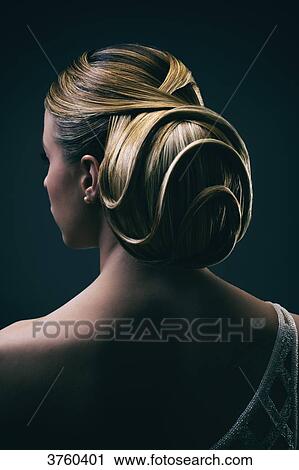 Portrait of a young woman wearing a bun, back View Large Photo Image Stock Image - Portrait of a young woman wearing a bun, back. Fotosearch