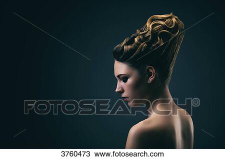 Portrait of a young woman wearing a bun, profile View Large Photo Image Stock Image - Portrait of a young woman wearing a bun, profile. Fotosearch