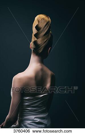 Portrait of a young woman wearing a bun, back View Large Photo Image Stock Photograph - Portrait of a young woman wearing a bun, back. Fotosearch