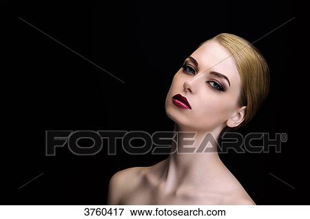 Portrait of an elegant young woman wearing a chignon View Large Photo Image Stock Photo - Portrait of an elegant young woman wearing a chignon. Fotosearch