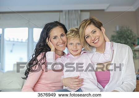 Portraits of two women and a boy smiling at camera View Large Photo Image Stock Photo - Portraits of two women and a boy smiling at camera. Fotosearch