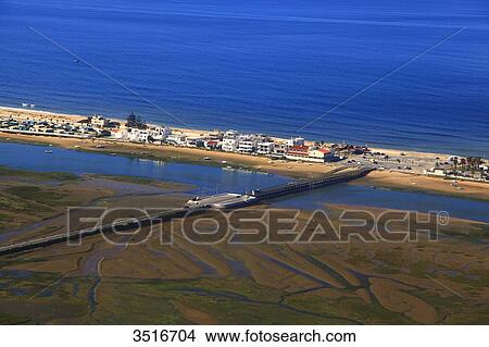 Portugal, Algarve. Faro. Brigde crossing the laguna leading to Praia de Faro and Ilha de Faro. View Large Photo Image Picture - Portugal, Algarve. Faro. Brigde crossing the laguna leading to Praia de Faro and Ilha de Faro.. Fotosearch