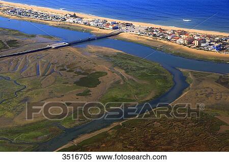 Portugal, Algarve. Faro. Brigde crossing the laguna leading to Praia de Faro and Ilha de Faro. View Large Photo Image Stock Photography - Portugal, Algarve. Faro. Brigde crossing the laguna leading to Praia de Faro and Ilha de Faro.. Fotosearch