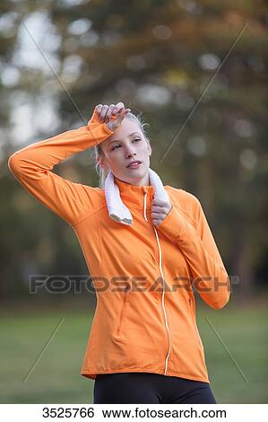 Pretty blonde woman exhausted after doing sport in park View Large Photo Image Stock Photograph - Pretty blonde woman exhausted after doing sport in park. Fotosearch
