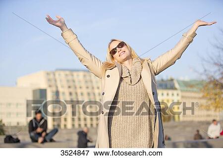 Pretty blonde woman happy doing tourism in a big city in Europe View Large Photo Image Stock Photo - Pretty blonde woman happy doing tourism in a big city in Europe. Fotosearch