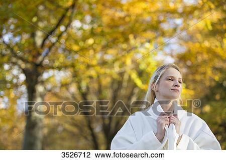 Pretty blonde woman with coat in Park in Autumn View Large Photo Image Stock Image - Pretty blonde woman with coat in Park in Autumn. Fotosearch