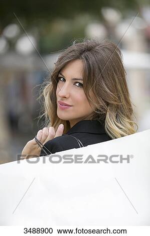 Pretty blonde woman with shopping bags in downtown View Large Photo Image Stock Image - Pretty blonde woman with shopping bags in downtown. Fotosearch
