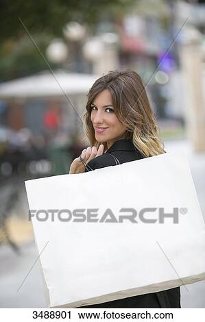 Pretty blonde woman with shopping bags in downtown View Large Photo Image Stock Image - Pretty blonde woman with shopping bags in downtown. Fotosearch