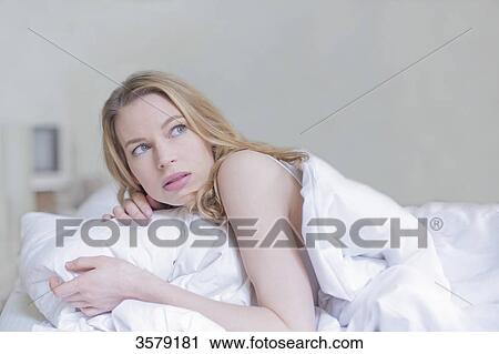 scared woman with nightmares in bed View Large Photo Image Stock Image - scared woman with nightmares in bed. Fotosearch