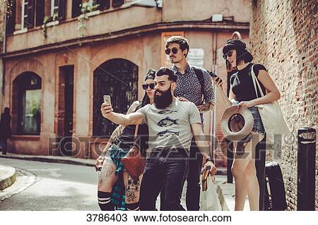 Selfie of a group of young people in an urban landscape View Large Photo Image Stock Image - Selfie of a group of young people in an urban landscape. Fotosearch