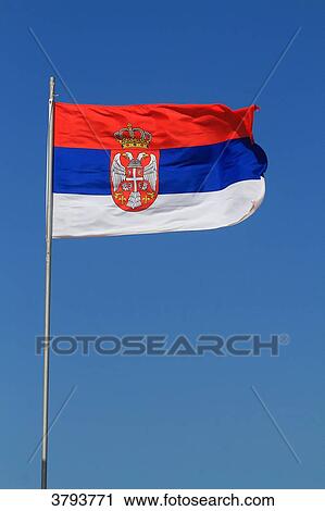 Stock Image - Serbian flag in blue sky.. Fotosearch