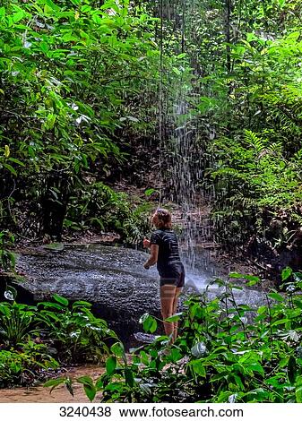 South America, woman taking a shower in the Amazon rainforest View Large Photo Image Stock Photo - South America, woman taking a shower in the Amazon rainforest. Fotosearch