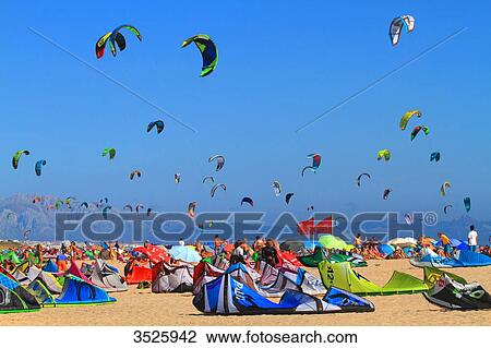Spain, Andalusia, Tarifa, crowded beach, sky full of kites, Africa in background View Large Photo Image Stock Image - Spain, Andalusia, Tarifa, crowded beach, sky full of kites, Africa in background. Fotosearch