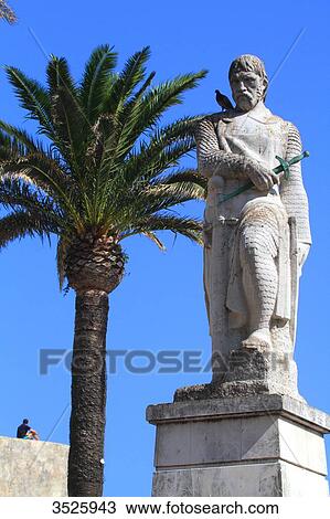 Stock Image - Spain, Andalusia, Tarifa, Paseo de la Alameda. Statue of Guzman el Bueno.. Fotosearch