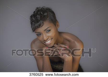 Studio portrait of a young black woman View Large Photo Image Stock Photography - Studio portrait of a young black woman. Fotosearch