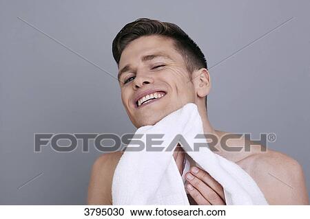 topless man, drying his chin and neck with a towel after shaving, smiling View Large Photo Image Stock Image - topless man, drying his chin and neck with a towel after shaving, smiling. Fotosearch