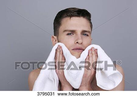 topless man, drying his chin and neck with a towel after shaving, sserious View Large Photo Image Stock Image - topless man, drying his chin and neck with a towel after shaving, sserious. Fotosearch