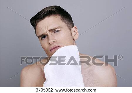 topless man, drying his chin with a towel after shaving, serious. View Large Photo Image Stock Image - topless man, drying his chin with a towel after shaving, serious.. Fotosearch