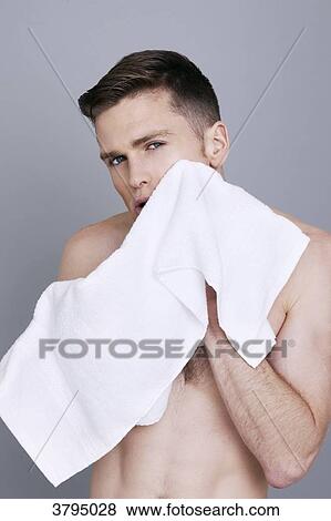 topless man, drying his face with a towel, serious, mouth open View Large Photo Image Stock Photo - topless man, drying his face with a towel, serious, mouth open. Fotosearch