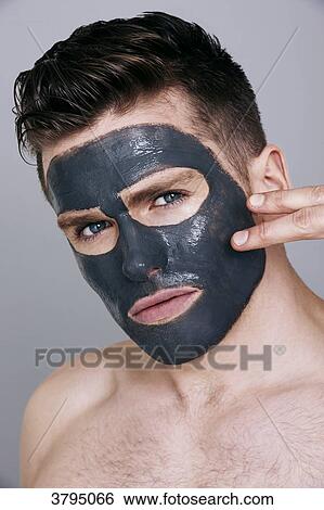 topless man, facemask on, looking at camera, serious, with two fingers on his face View Large Photo Image Stock Photograph - topless man, facemask on, looking at camera, serious, with two fingers on his face. Fotosearch