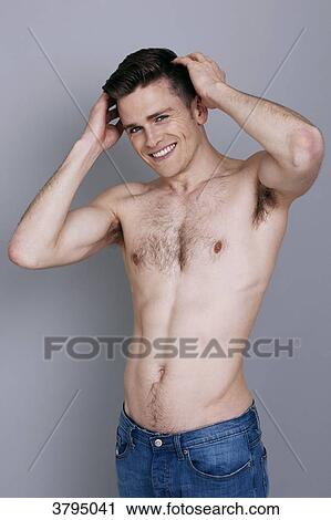 topless man, hands on his hair, arms up, wearing jeans, smiling View Large Photo Image Stock Image - topless man, hands on his hair, arms up, wearing jeans, smiling. Fotosearch